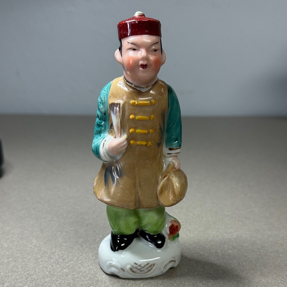 Hand painted porcelain Asian man Red, Teal, and Tan Figurine